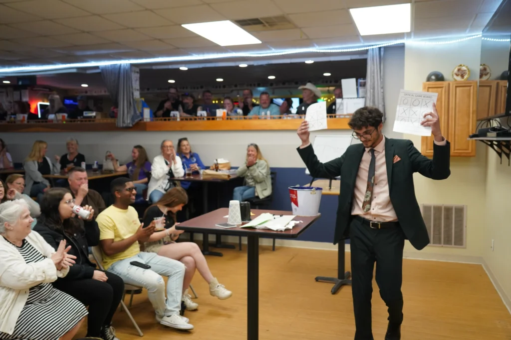 Matt The Mystic is performing mentalism among corporate employees.